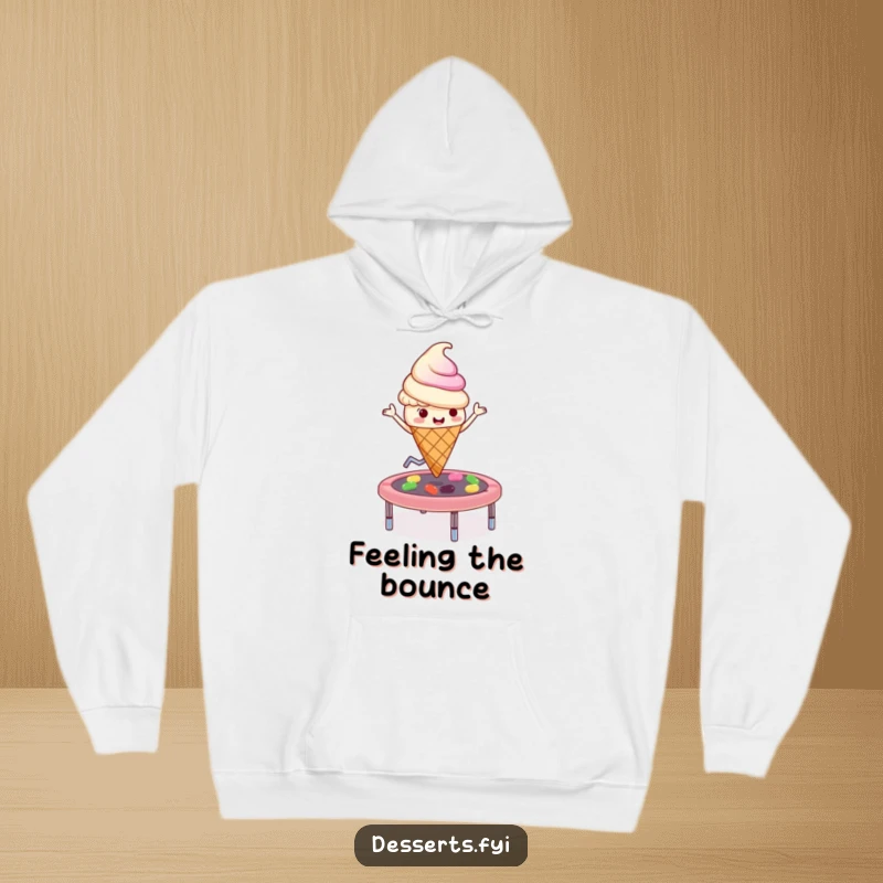 Funny playful ice cream cone character bouncing on a jelly bean trampoline, depicted on a cozy hoodie, perfect for playful comfort.